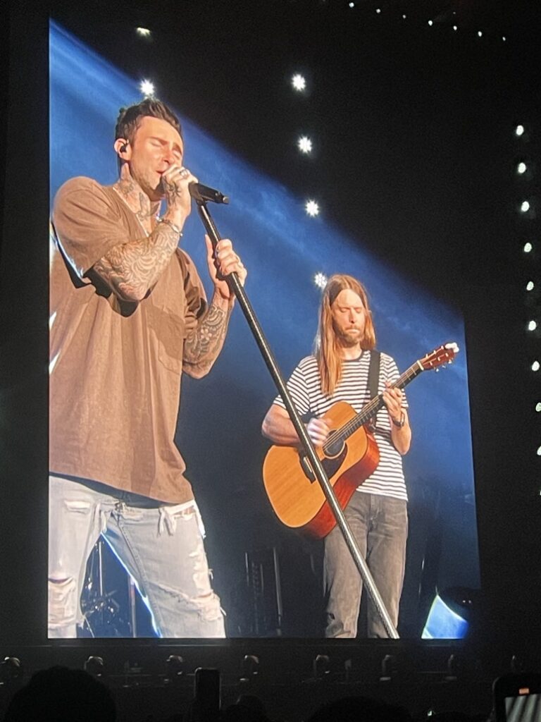 Adam Levine and James Valentine of Maroon 5 performing together on the big screen at Kyocera Dome Osaka