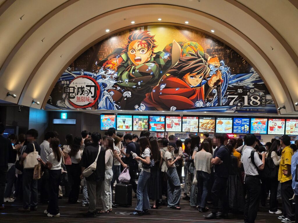 Umeda Osaka TOHO Cinemas snack area with Demon Slayer ceiling poster
