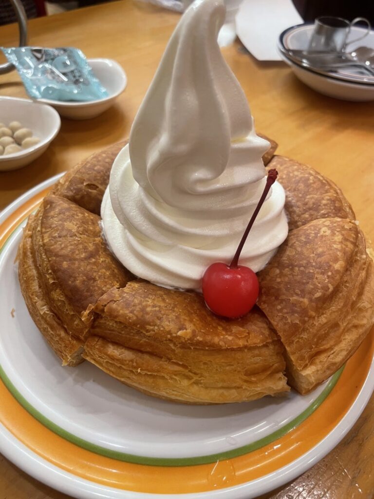 Close-up of Komeda Coffee’s Shiro Noir pastry with soft-serve