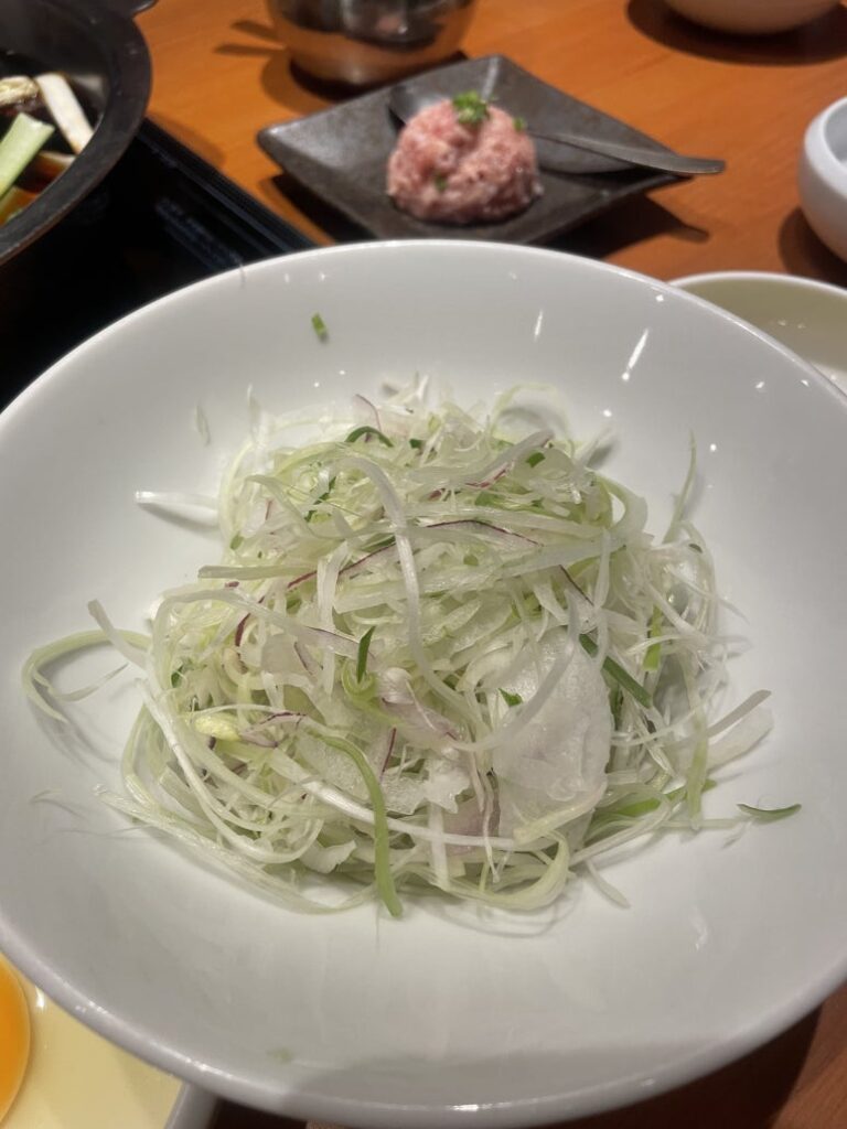 A bowl of finely shredded vegetables served at Kinnobuta