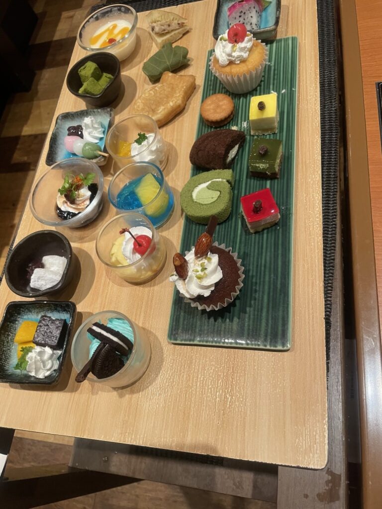 A dessert cart at Kinnobuta featuring a variety of colorful sweets