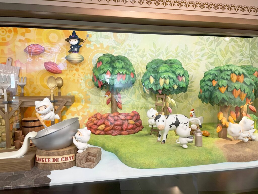 Cute animal characters showing the chocolate-making process in a diorama at Shiroi Koibito Park.