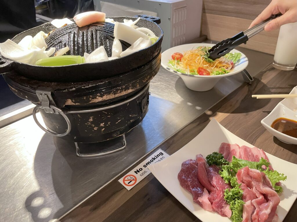 Traditional Jingisukan grilled lamb served with vegetables at a restaurant in Susukino, Sapporo, Hokkaido