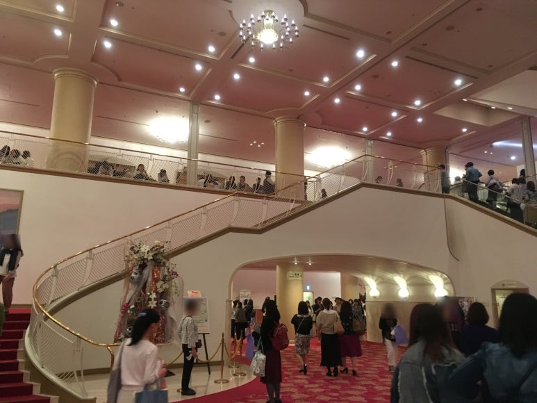 View of chandelier from base of foyer staircase