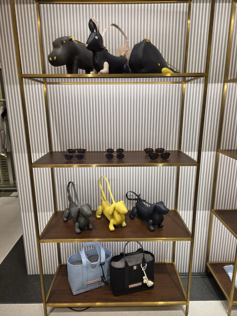Display shelf with animal-shaped bags including Hector, hippo, rabbit and whale