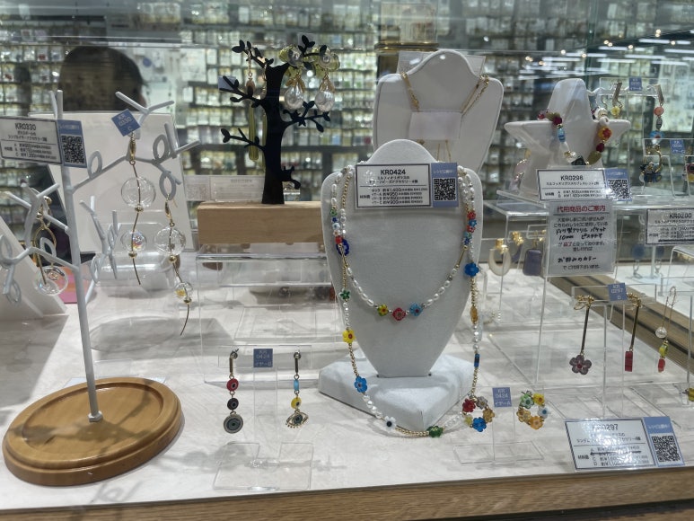 Colorful necklaces and earrings displayed at Kiwa Seisakusyo