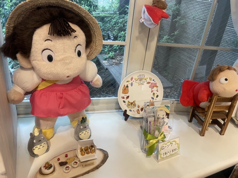 Mei and Ponyo dolls displayed inside Shirohige’s Cream Puff Factory