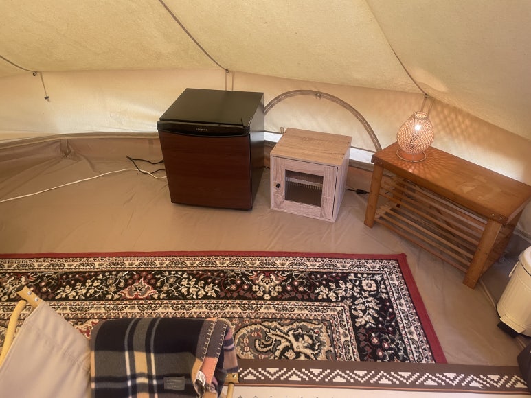 Mini fridge and lighting on the right side of the tent