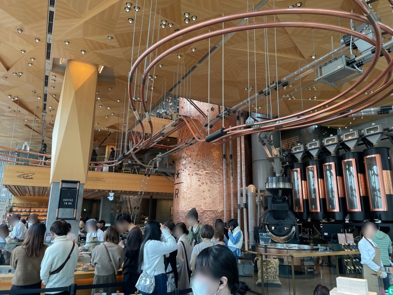 Large roasting equipment and crowds on the first floor