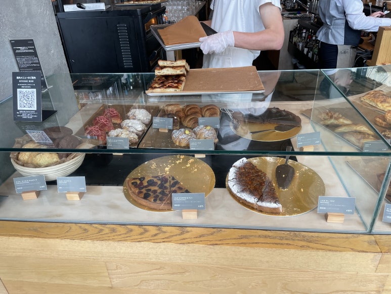 Assorted cakes displayed in the bakery showcase