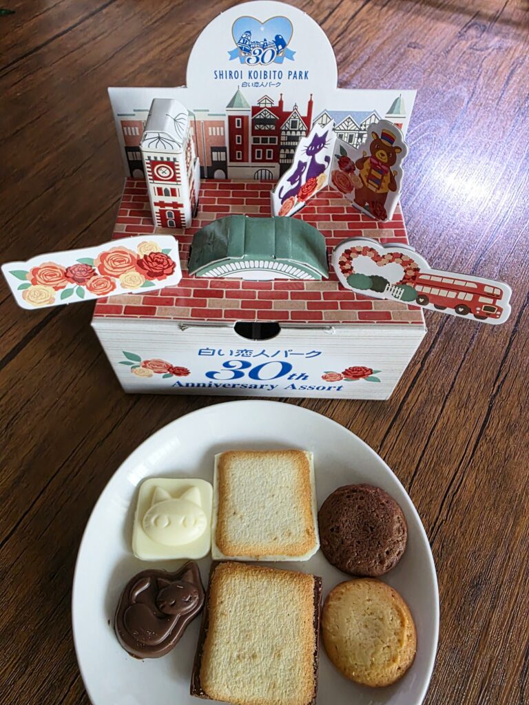 Assembled package with Shiroi Koibito, chocolates, and cookies on a plate