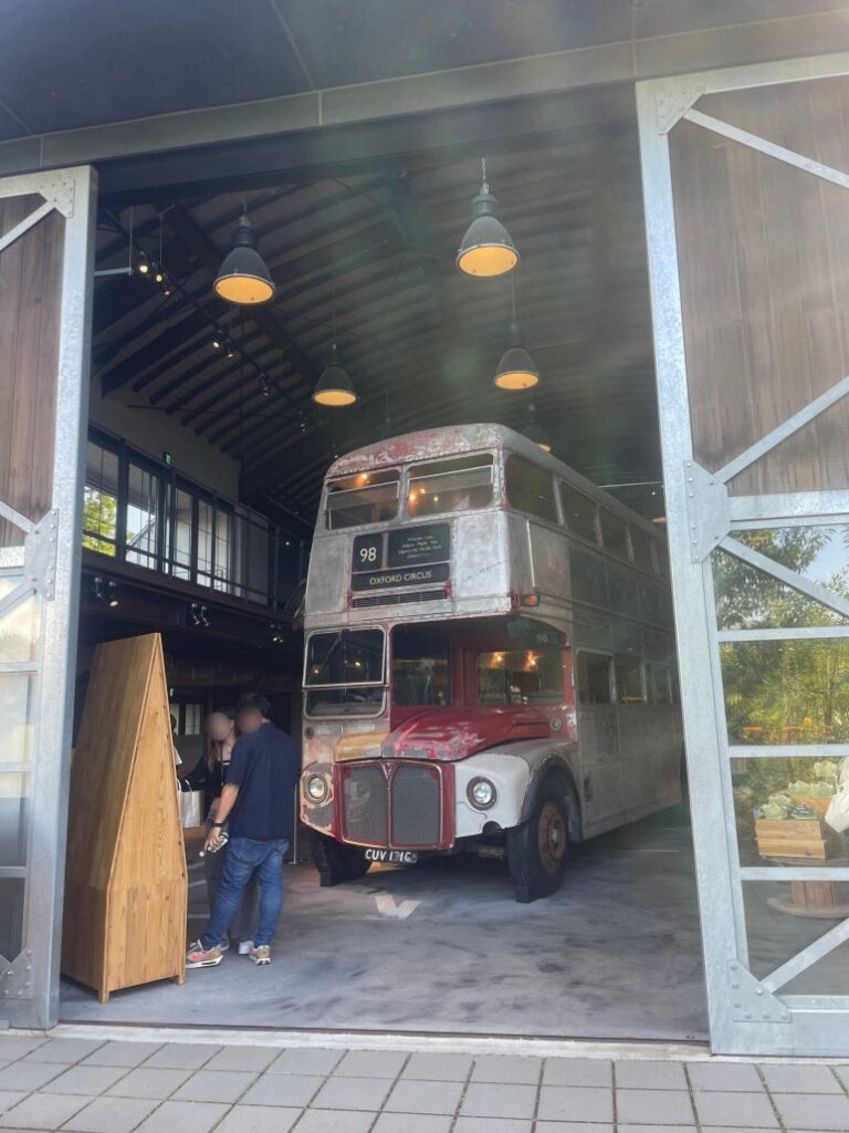 Large bus displayed at the entrance of the gift shop at La Collina