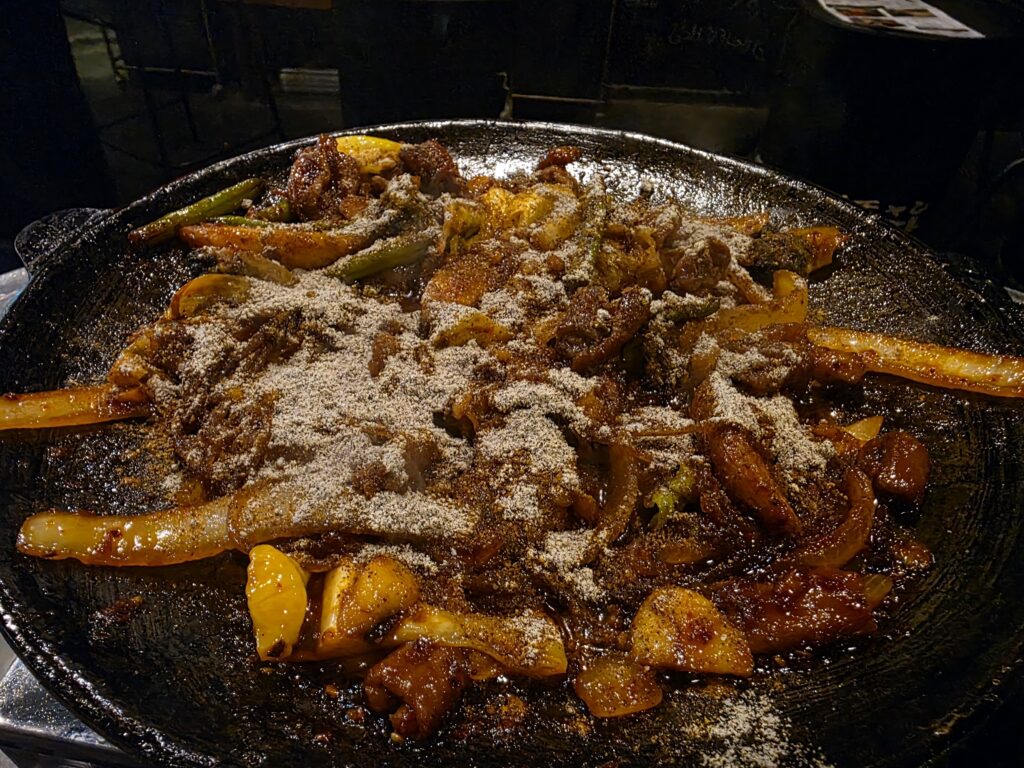 Marinated gopchang after being cooked on the iron plate