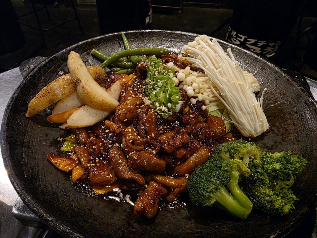 Marinated gopchang on the iron plate before grilling