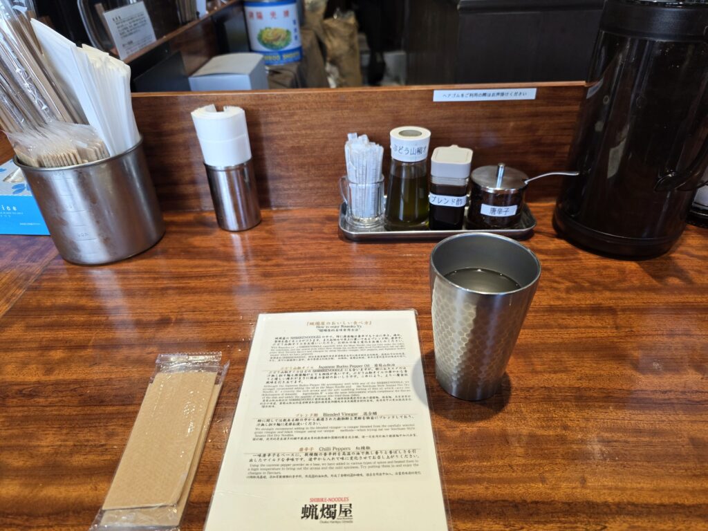 Counter items including condiments and utensils