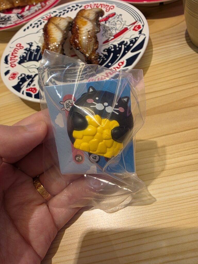Close-up of the Dakkosushi character clip prize