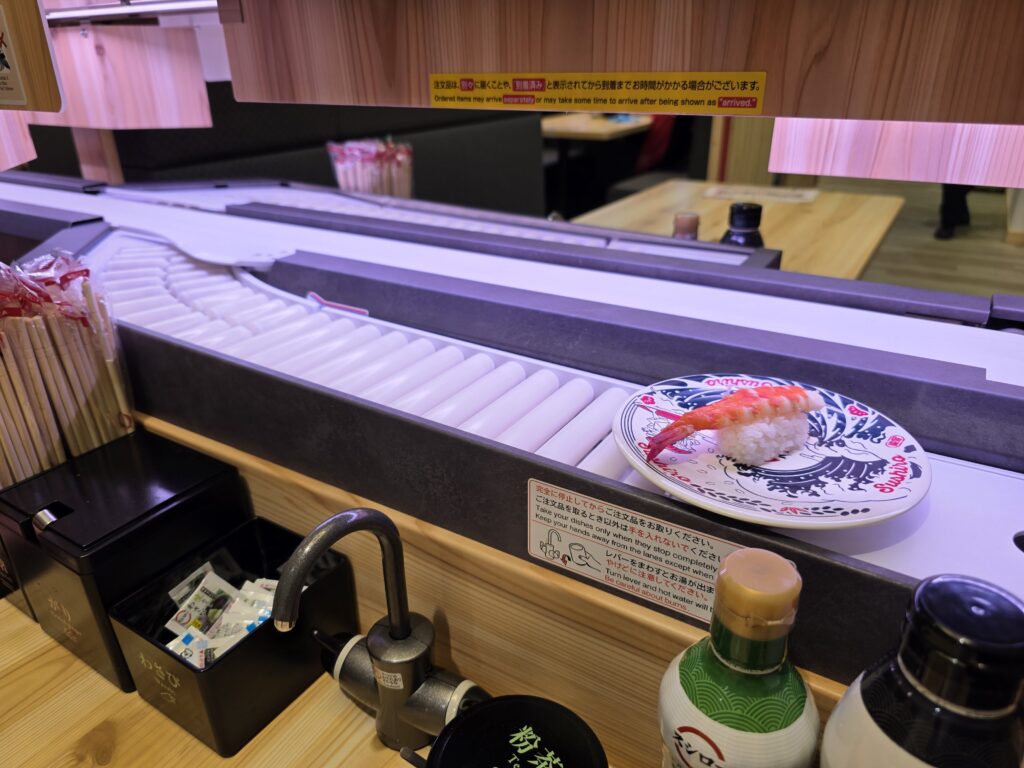 Ordered sushi arriving at the table via the conveyor belt